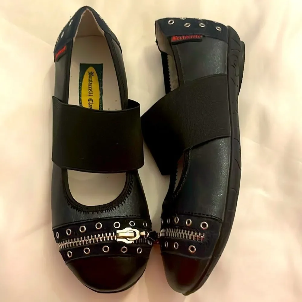 BOUTACCELLI CLASSICS black zippered front, stud design w/studs also on back heel